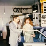 Mr Allan Severin showing a client a new car at P.L. Bolto & Co